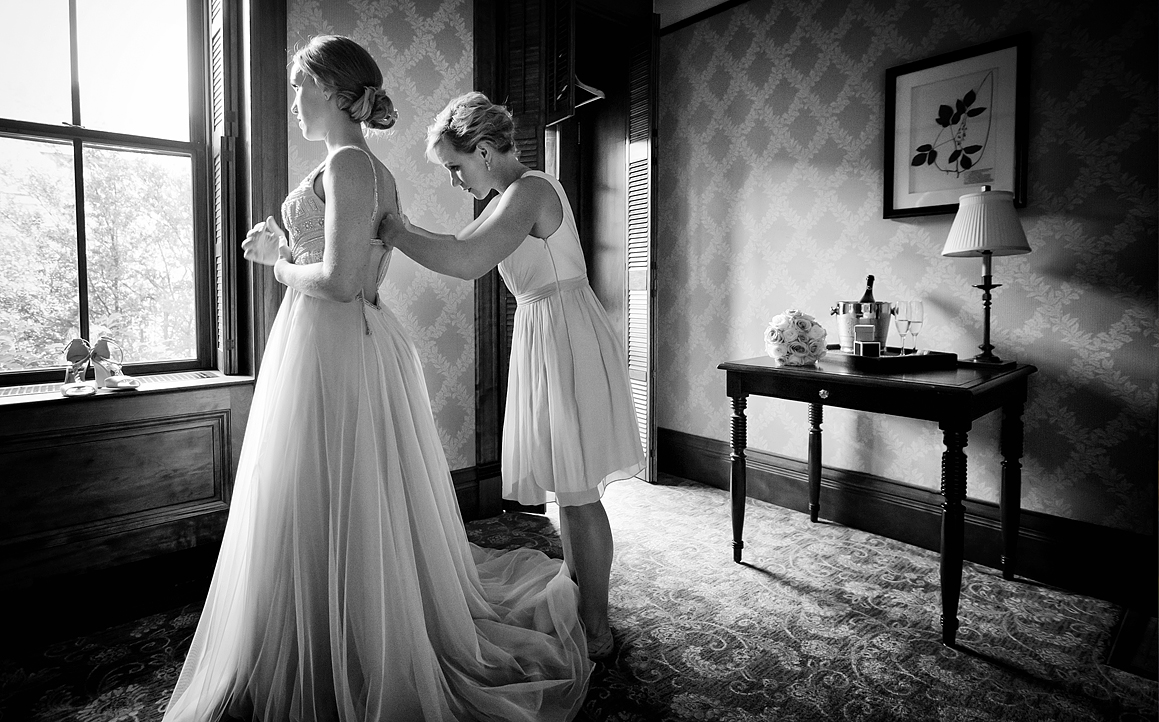 black and white wedding photo of bride getting ready at Mohonk Mountain House in the Catskills